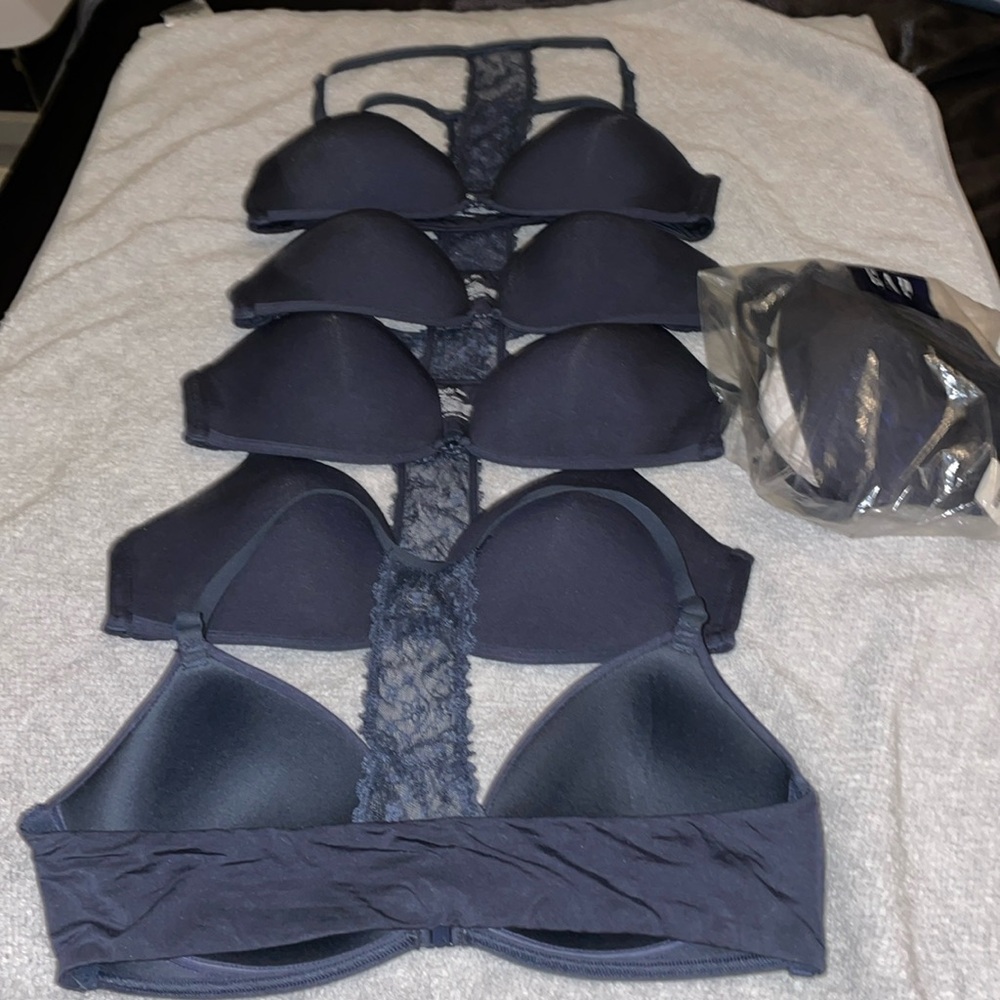 7 lightly used + 1 new Gap Body bras. 6 Slate Blue. 1 Seafoam. 1 Gray.